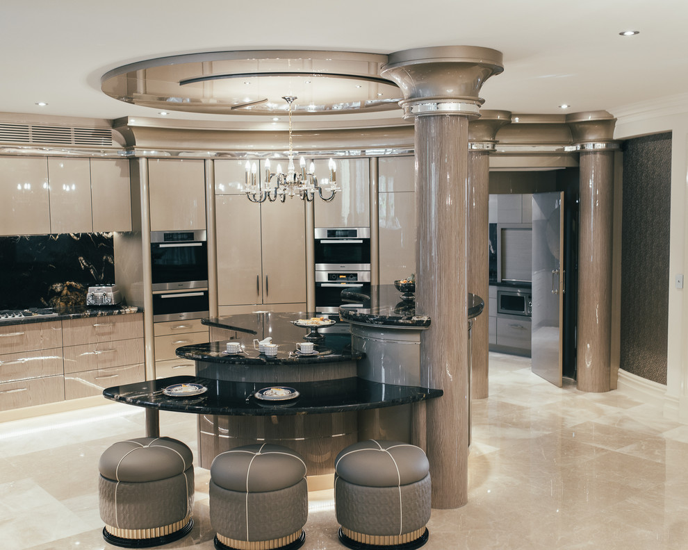 Photo of an expansive transitional u-shaped open plan kitchen in Perth with a double-bowl sink, beige cabinets, granite benchtops, black splashback, stone slab splashback, black appliances, marble floors and with island.