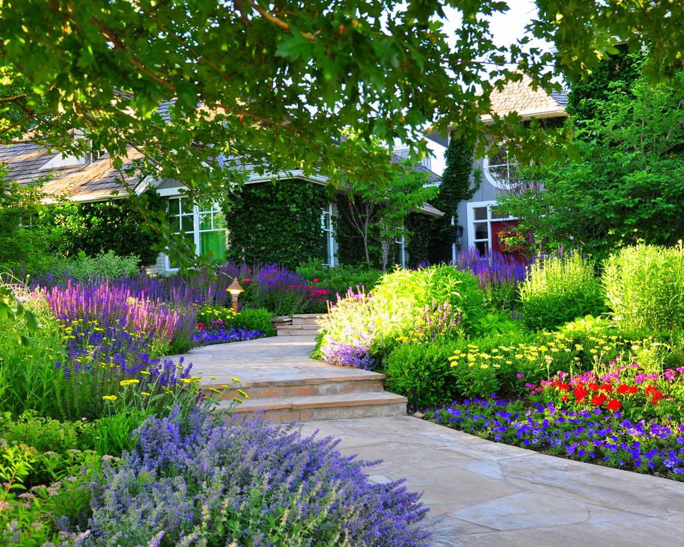 Design ideas for a traditional front yard partial sun garden for summer in Denver with with flowerbed.