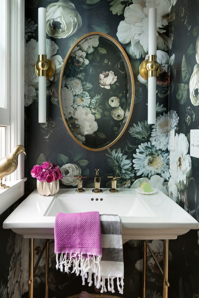 Transitional powder room in Minneapolis with multi-coloured walls and a console sink.