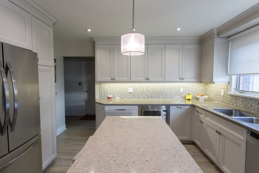 Example of a transitional kitchen design in Toronto