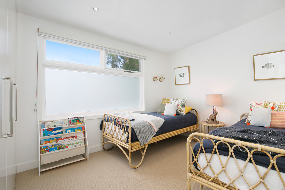 Contemporary gender-neutral kids' bedroom in Sydney with white walls, carpet and beige floor for kids 4-10 years old.