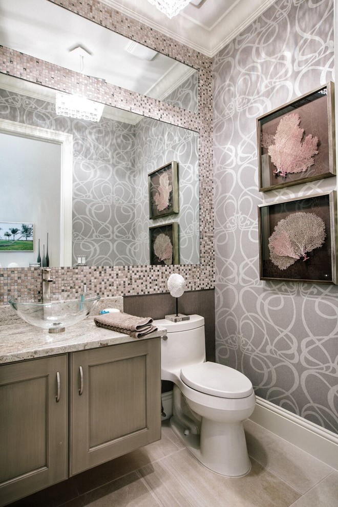 Design ideas for a small contemporary powder room in Miami with recessed-panel cabinets, light wood cabinets, a one-piece toilet, black and white tile, mosaic tile, multi-coloured walls, linoleum floors, a vessel sink, engineered quartz benchtops and beige floor.