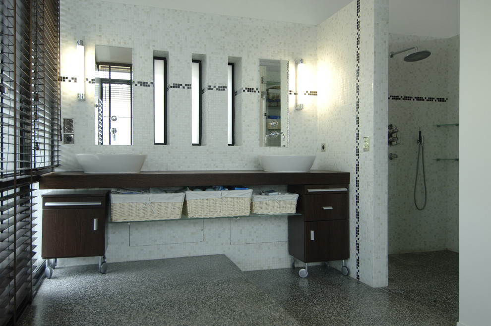 Photo of a large modern master bathroom in Paris with a hot tub, mosaic tile, wood benchtops, a two-piece toilet, a drop-in sink, beaded inset cabinets, medium wood cabinets, a curbless shower, white tile, gray tile, white walls, grey floor, an open shower and brown benchtops.