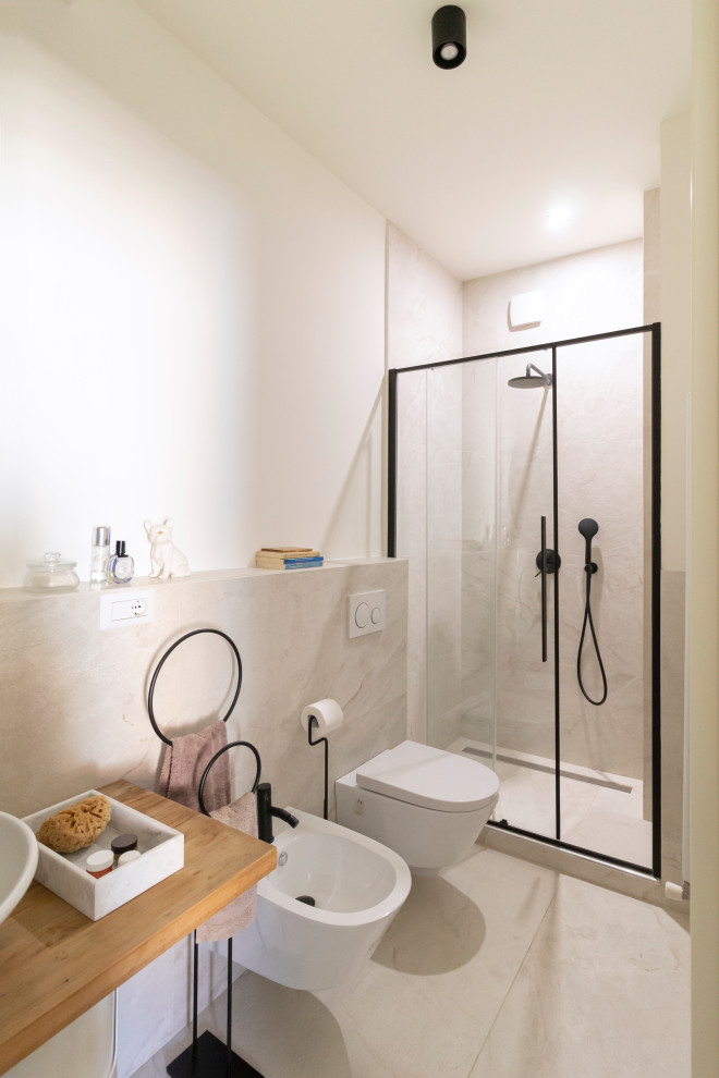 This is an example of a small contemporary 3/4 bathroom in Milan with open cabinets, an alcove shower, beige tile, porcelain tile, wood benchtops and a floating vanity.