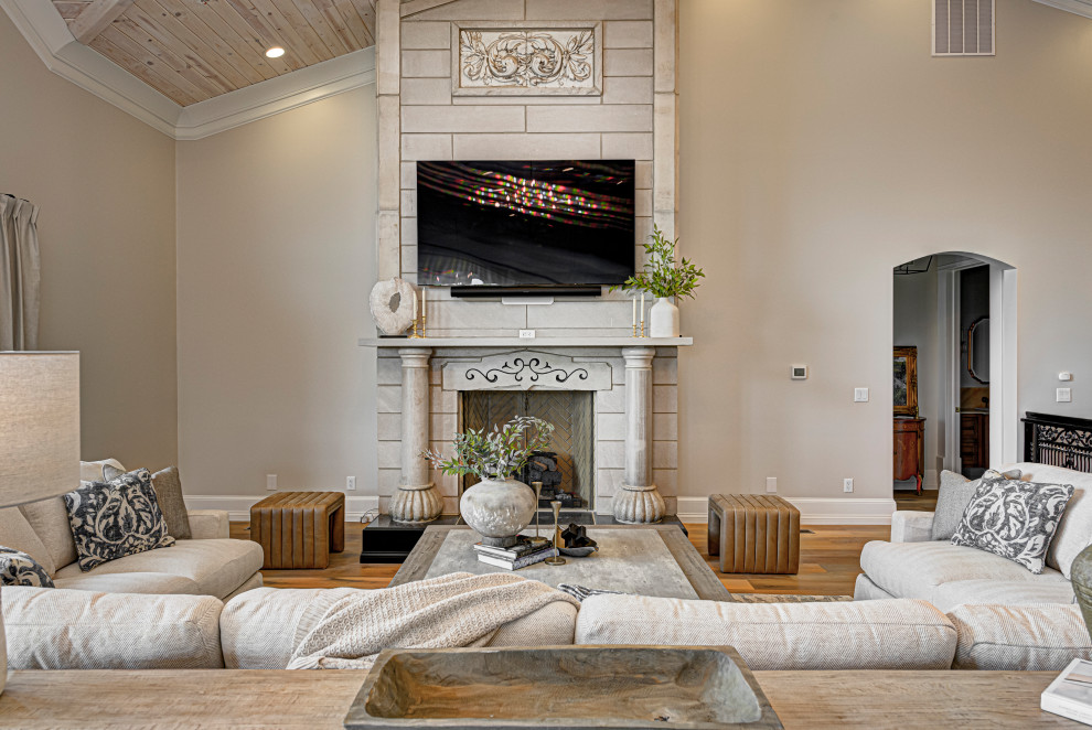 This is an example of a medium sized contemporary living room in Indianapolis with medium hardwood flooring, a standard fireplace, a wall mounted tv, a wood ceiling, a tiled fireplace surround and brown floors.