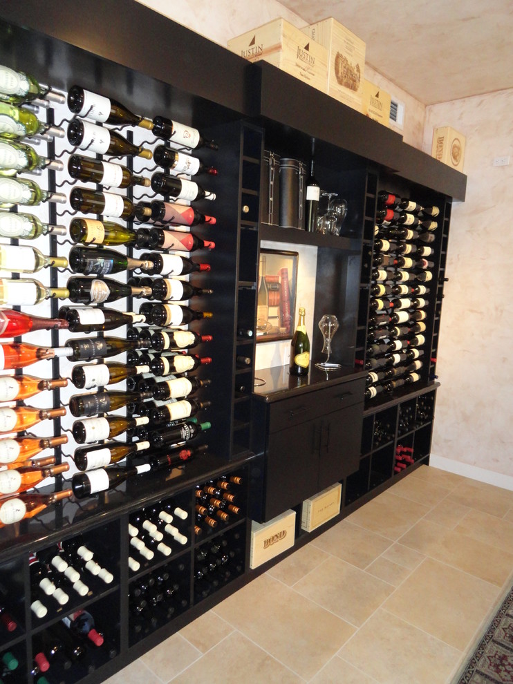 Large contemporary wine cellar in San Diego with ceramic floors and display racks.