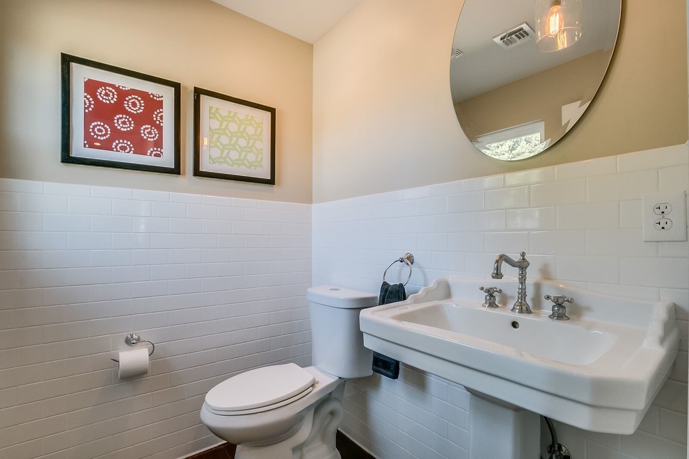 Inspiration for a large transitional white tile and subway tile medium tone wood floor and brown floor bathroom remodel in Phoenix with a two-piece toilet, gray walls and a pedestal sink