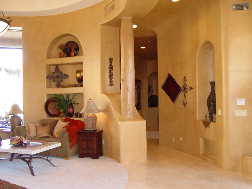 This is an example of a large country formal enclosed living room in Phoenix with yellow walls, carpet and no tv.