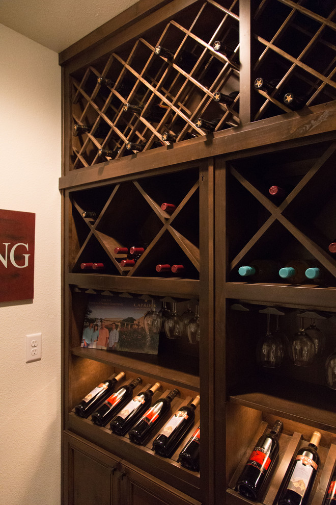 This is an example of a transitional wine cellar in Dallas.