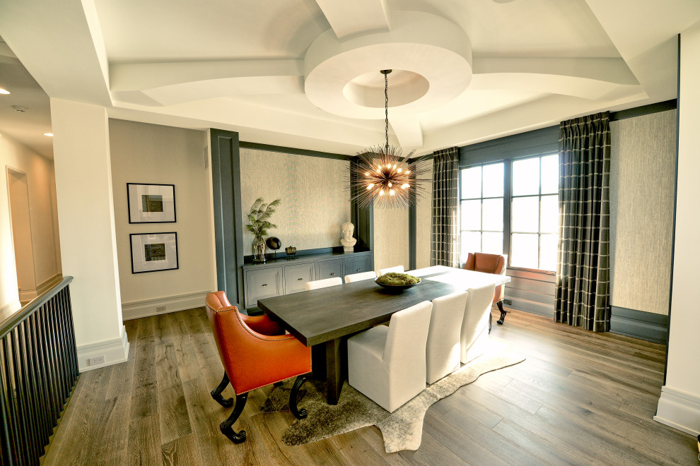 Design ideas for a large modern dining room in Indianapolis with grey walls, medium hardwood floors, brown floor, coffered and wallpaper.