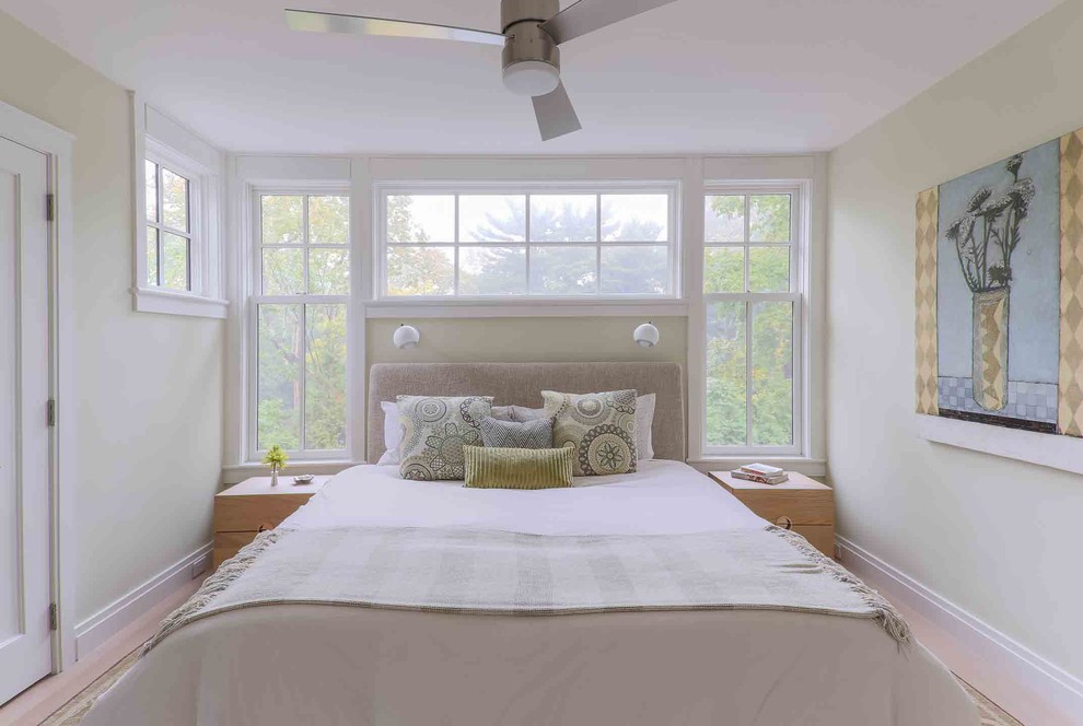 Large transitional master bedroom in Boston with green walls and no fireplace.