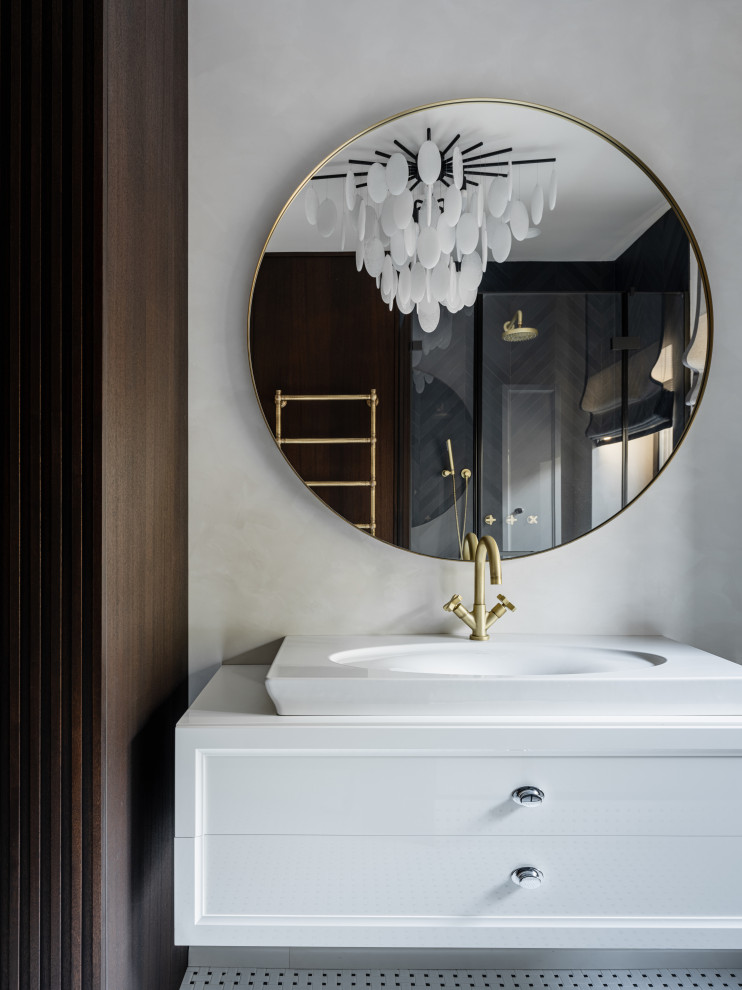 На фото: ванная комната среднего размера в современном стиле с черной плиткой, душевой кабиной, накладной раковиной, зеркалом с подсветкой, тумбой под одну раковину и подвесной тумбой с