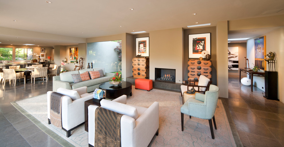 Photo of a contemporary formal open concept living room in Santa Barbara with beige walls and a standard fireplace.