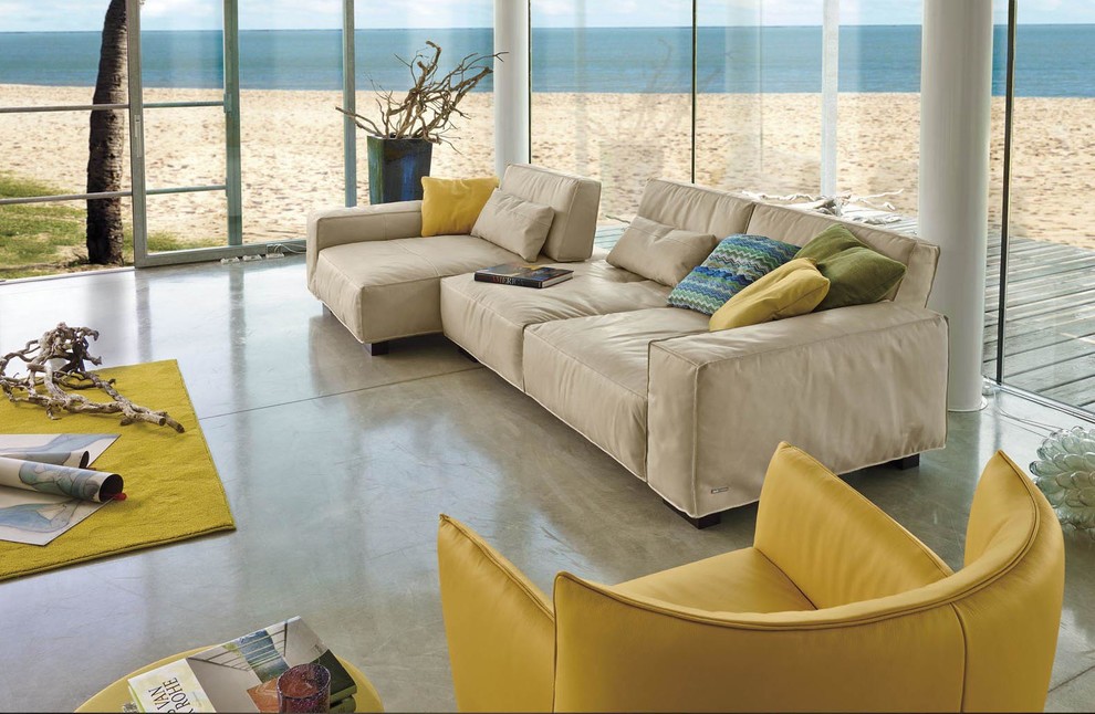 Design ideas for a large contemporary open concept living room in Santa Barbara with concrete floors and no tv.