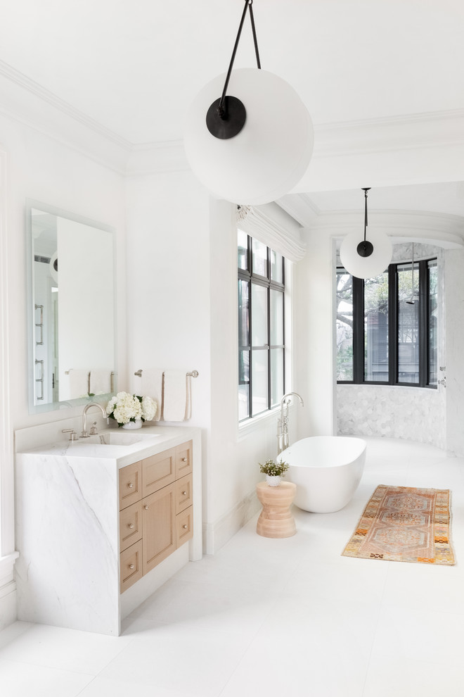 Design ideas for a large transitional master bathroom in Austin with brown cabinets, a freestanding tub, a corner shower, white walls, a drop-in sink, an open shower and white benchtops.