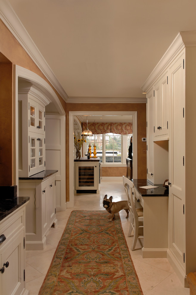 Photo of a mid-sized traditional l-shaped eat-in kitchen in DC Metro with white cabinets, an undermount sink, beaded inset cabinets, multi-coloured splashback, stainless steel appliances, multiple islands, marble floors, granite benchtops, cement tile splashback and beige floor.