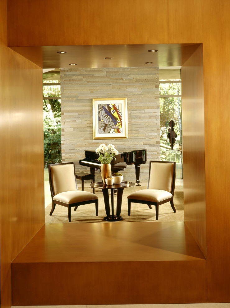 Modern open concept living room in Los Angeles with carpet and a stone fireplace surround.