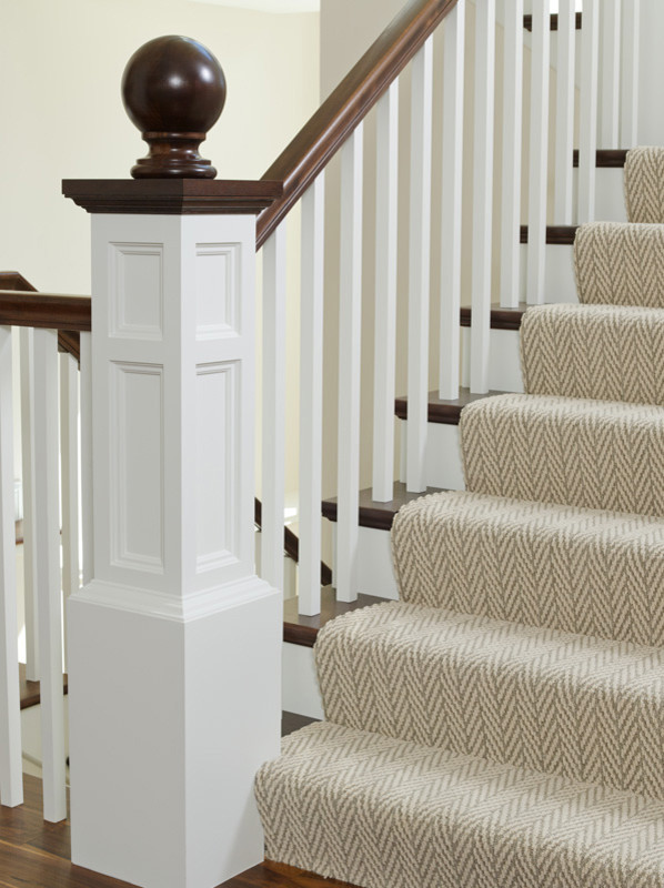 Inspiration for a large traditional wood u-shaped staircase in Minneapolis with painted wood risers.
