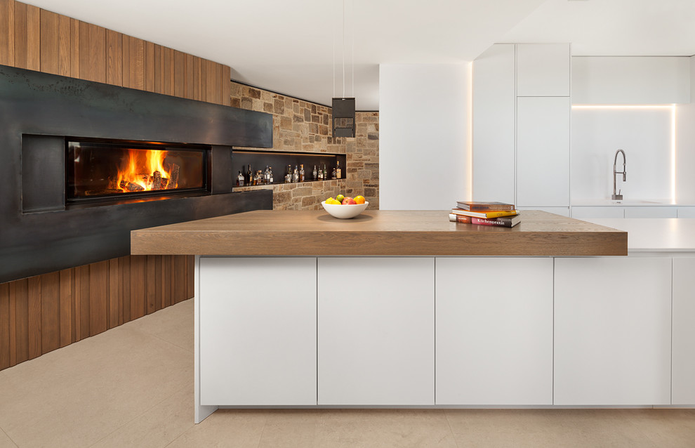 Inspiration for an expansive traditional open plan kitchen in Other with flat-panel cabinets, white cabinets, white splashback and with island.