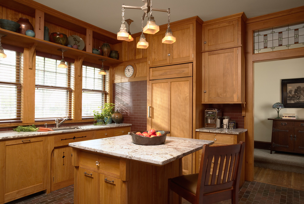 Inspiration for an arts and crafts u-shaped separate kitchen in Minneapolis with an undermount sink, shaker cabinets, medium wood cabinets, granite benchtops, red splashback, subway tile splashback, panelled appliances, slate floors and with island.