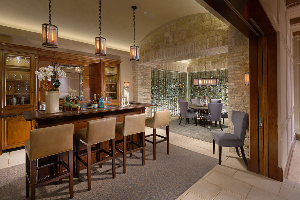 This is an example of a mediterranean seated home bar in Orange County.