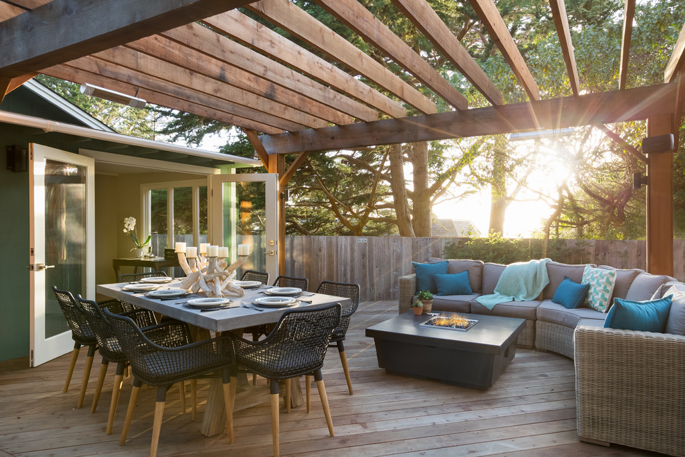 Photo of a transitional backyard deck in St Louis with a pergola.