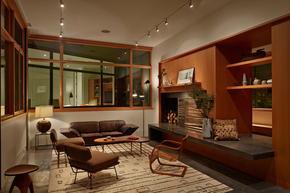 This is an example of a contemporary living room in San Francisco with concrete floors.