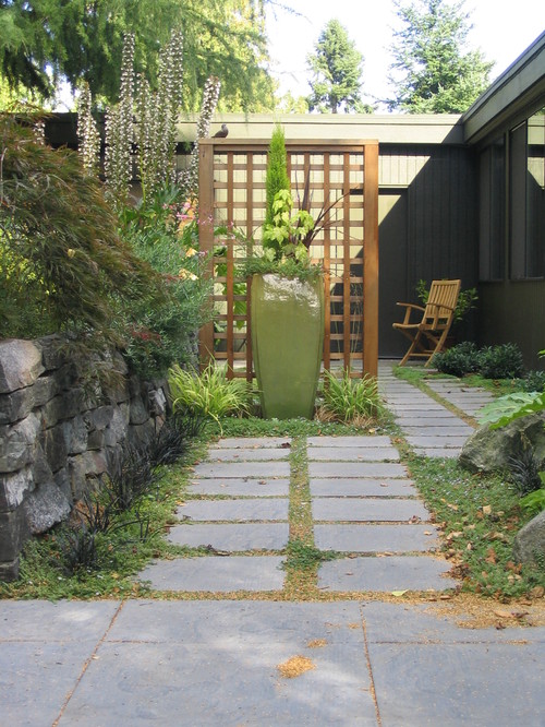 A clean lattice fence divides this space without blocking too much visibility.