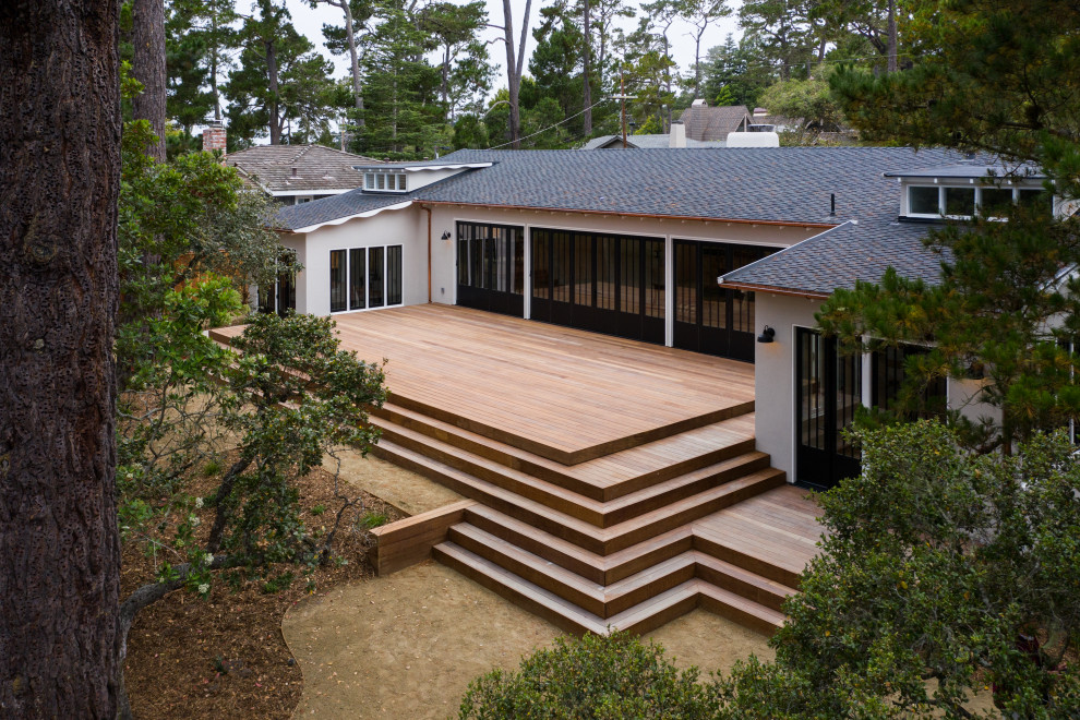 Large transitional backyard deck photo