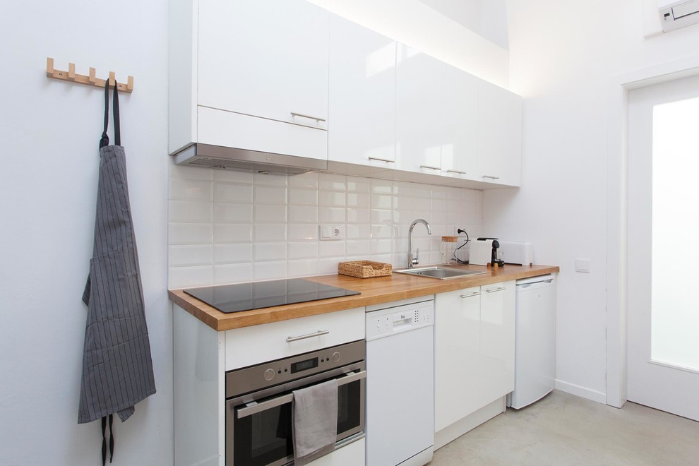 This is an example of a small mediterranean kitchen in Barcelona.