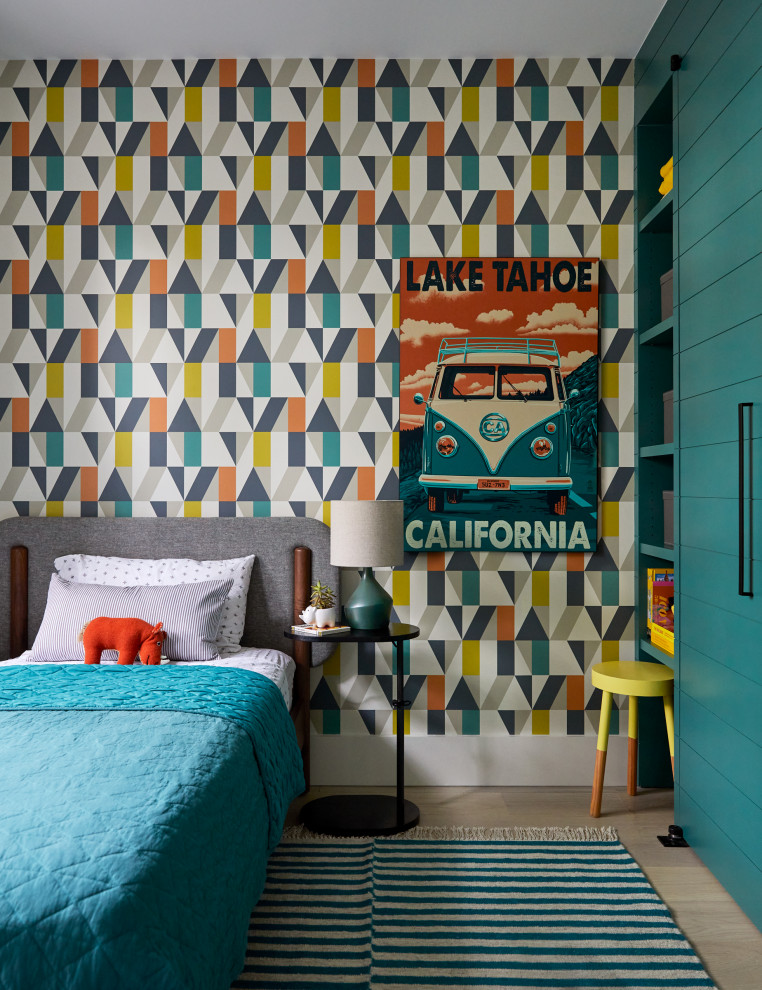 Bedroom trendy boy light wood floor, beige floor and wallpaper kids' bedroom photo in San Francisco with multicolored walls