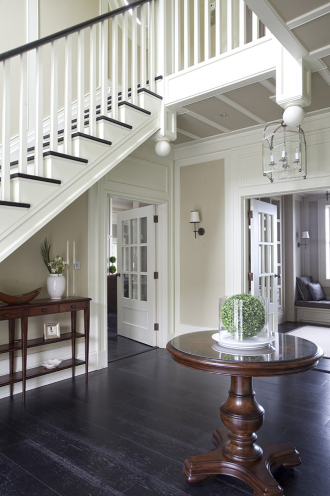 Traditional entry hall in Dublin with beige walls and black floor.