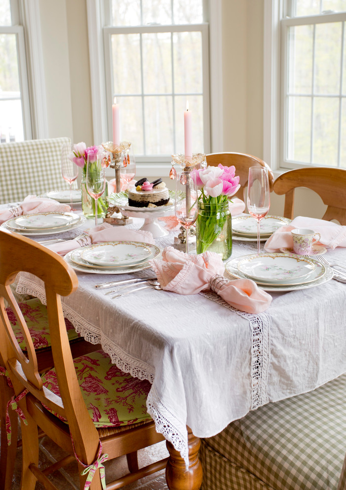 Example of a cottage chic dining room design in New York