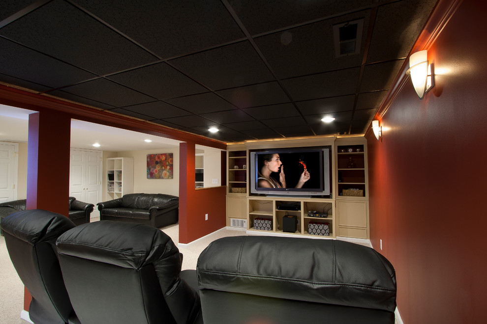 Large traditional open concept home theatre in Newark with red walls, carpet and a built-in media wall.