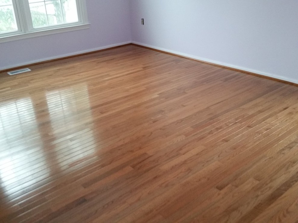 Inspiration for a mid-sized transitional light wood floor bedroom remodel in DC Metro with gray walls
