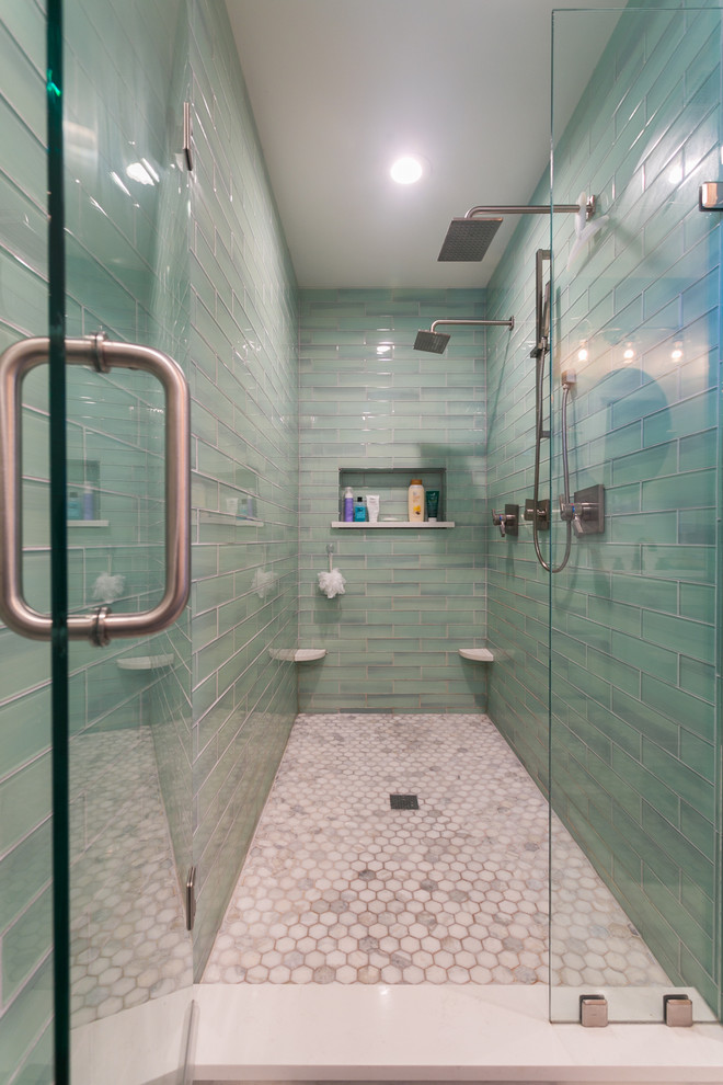 This is an example of a mid-sized arts and crafts master bathroom in Nashville with shaker cabinets, white cabinets, a double shower, a one-piece toilet, blue tile, glass tile, grey walls, marble floors, an undermount sink and engineered quartz benchtops.