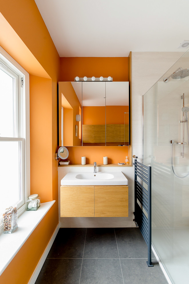 Inspiration for a contemporary bathroom in Other with orange walls and grey floor.