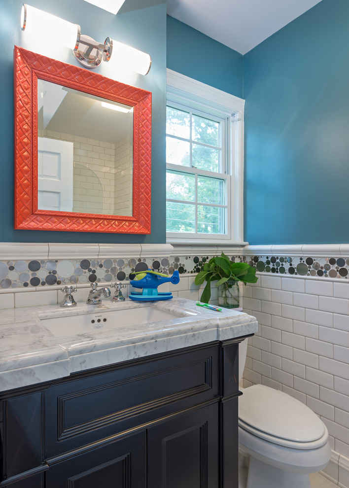 Inspiration for a small traditional master bathroom in St Louis with a vessel sink, recessed-panel cabinets, dark wood cabinets, onyx benchtops, an alcove tub, an alcove shower, white tile, brown walls, slate floors and a two-piece toilet.