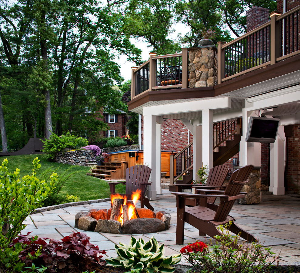 Inspiration for a traditional backyard patio in Other with a fire feature and no cover.
