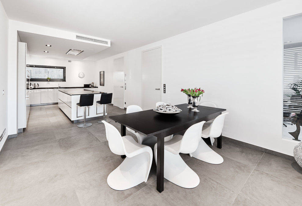Inspiration for a contemporary open plan dining in Dusseldorf with white walls.