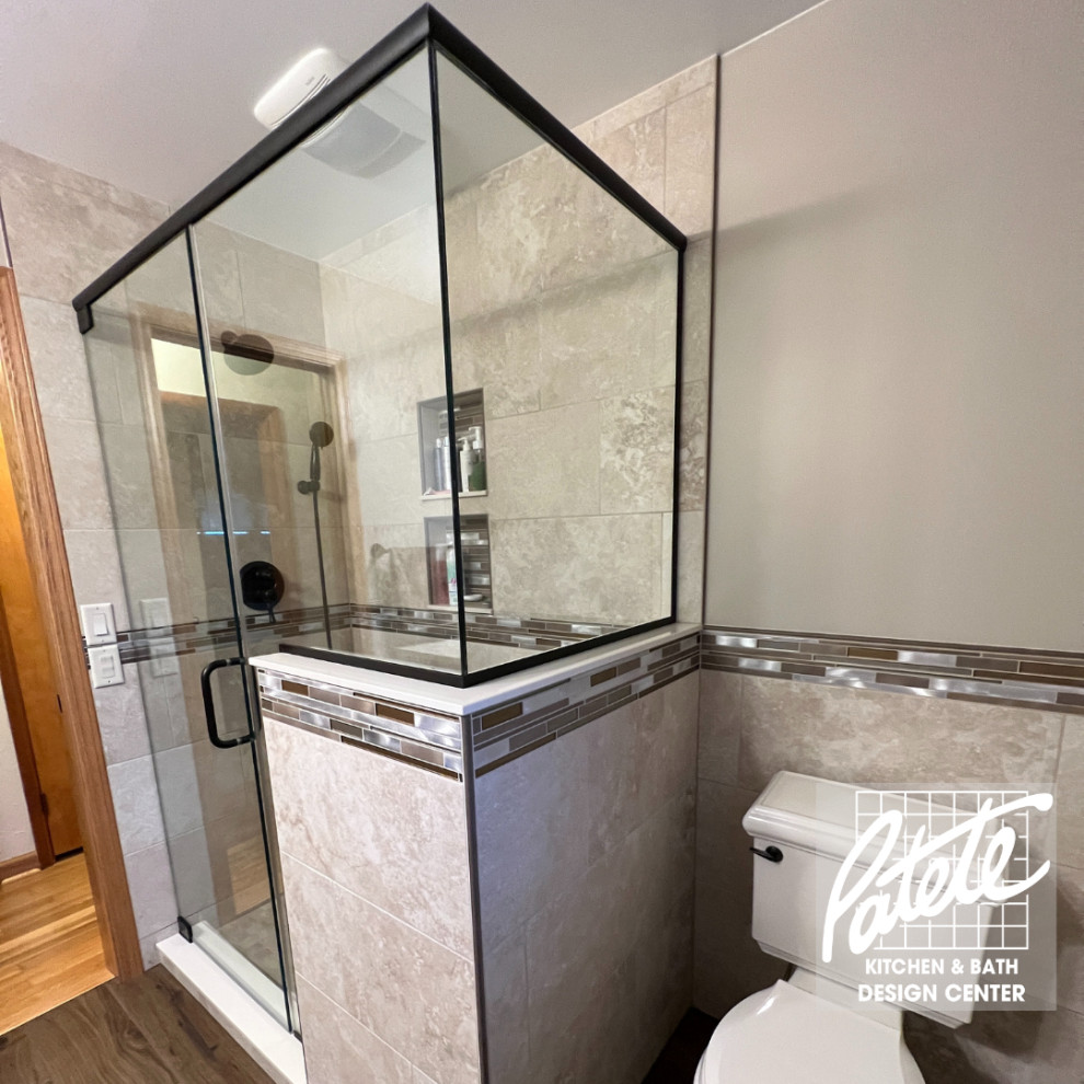 Design ideas for a mid-sized traditional bathroom with brown cabinets, a corner shower, a one-piece toilet, beige tile, stone slab, beige walls, wood-look tile, quartzite benchtops, brown floor, a hinged shower door, beige benchtops, a shower seat and a single vanity.