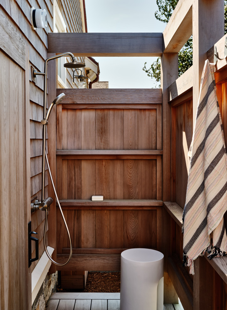 Inspiration for a mid-sized coastal backyard outdoor patio shower remodel in Boston with decking and a pergola