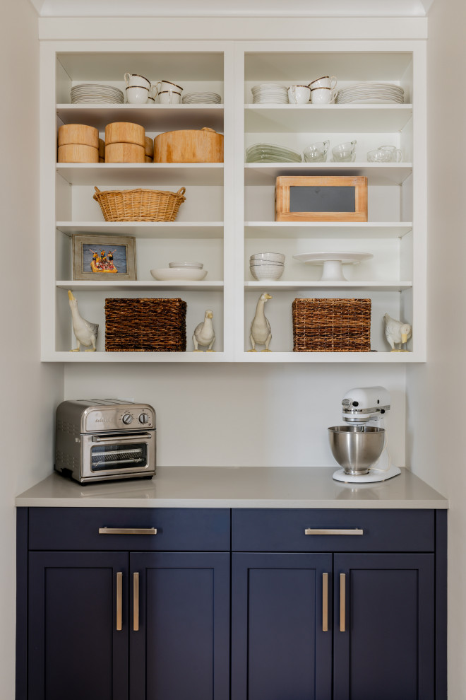 Inspiration for a transitional kitchen remodel in Providence with an undermount sink, shaker cabinets, quartzite countertops, subway tile backsplash and an island