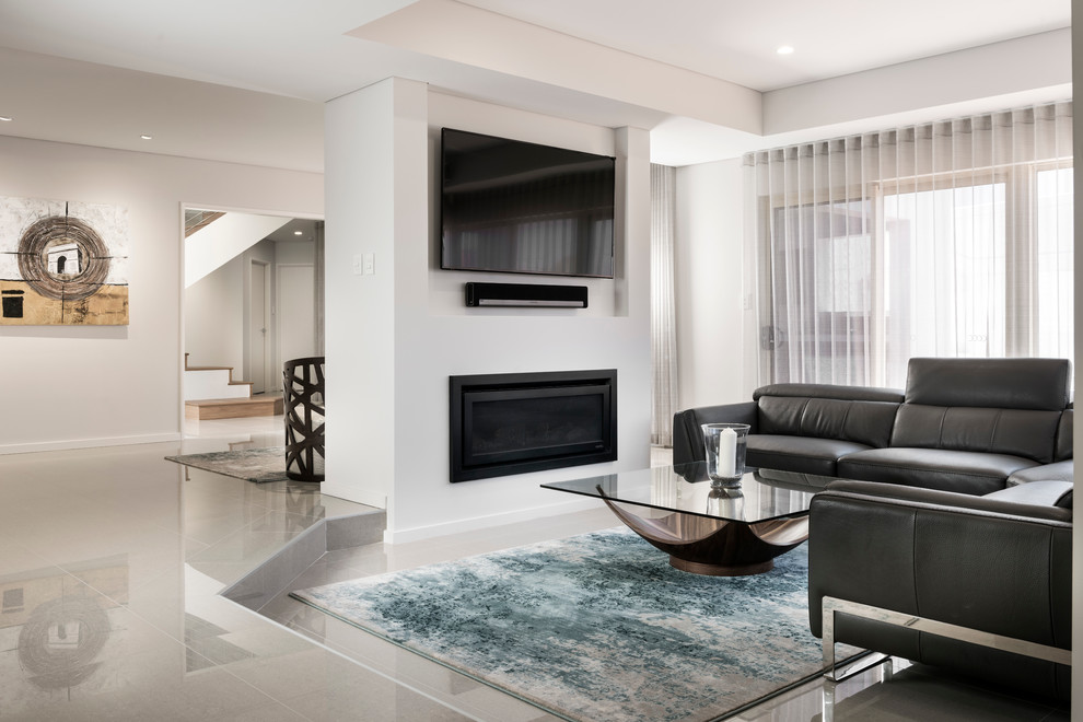This is an example of a mid-sized contemporary open concept living room in Perth with white walls, porcelain floors, a standard fireplace, a metal fireplace surround and a wall-mounted tv.