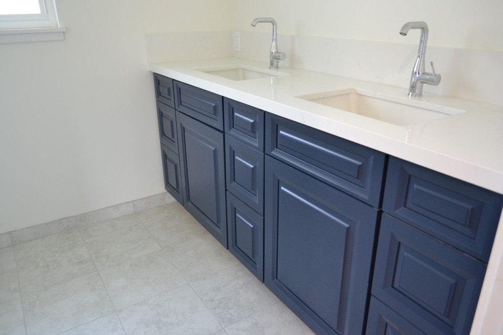 Example of a mid-sized farmhouse kids' white tile and porcelain tile double-sink bathroom design in San Francisco with raised-panel cabinets, blue cabinets, an undermount sink, quartz countertops, white countertops and a built-in vanity