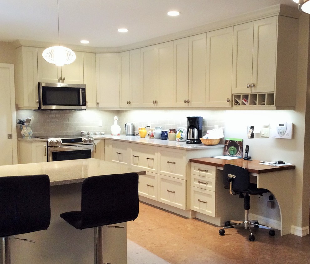 Kitchen - transitional cork floor kitchen idea in Edmonton with white cabinets, quartzite countertops, gray backsplash, ceramic backsplash and stainless steel appliances
