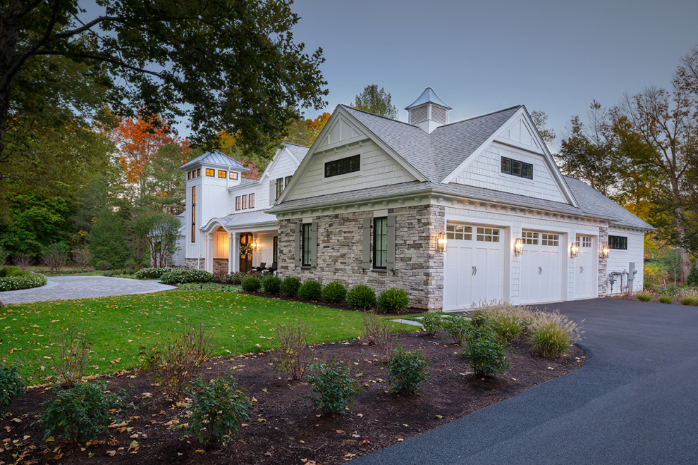 Large minimalist white two-story concrete fiberboard and shingle exterior home photo in New York with a mixed material roof and a gray roof