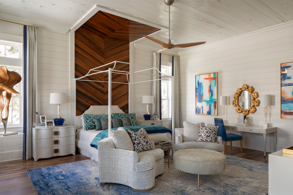 Photo of a large beach style master bedroom in Other with white walls, medium hardwood flooring, brown floors, a wood ceiling and tongue and groove walls.