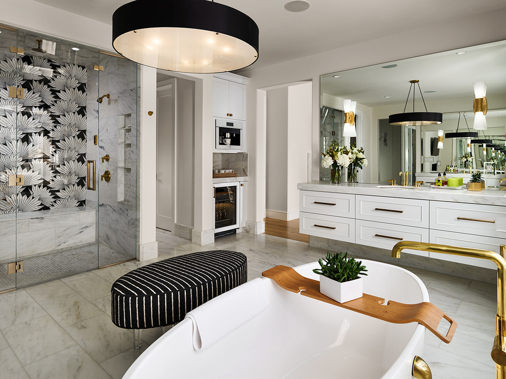 Design ideas for a transitional master bathroom in Denver with recessed-panel cabinets, white cabinets, a freestanding tub, a curbless shower, multi-coloured tile, an undermount sink, white floor, a hinged shower door, white benchtops, a shower seat and a floating vanity.