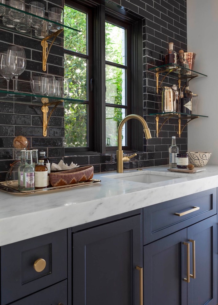 Inspiration for a modern single-wall kitchen in Raleigh with marble benchtops, subway tile splashback, white benchtop, an undermount sink, recessed-panel cabinets, blue cabinets and black splashback.